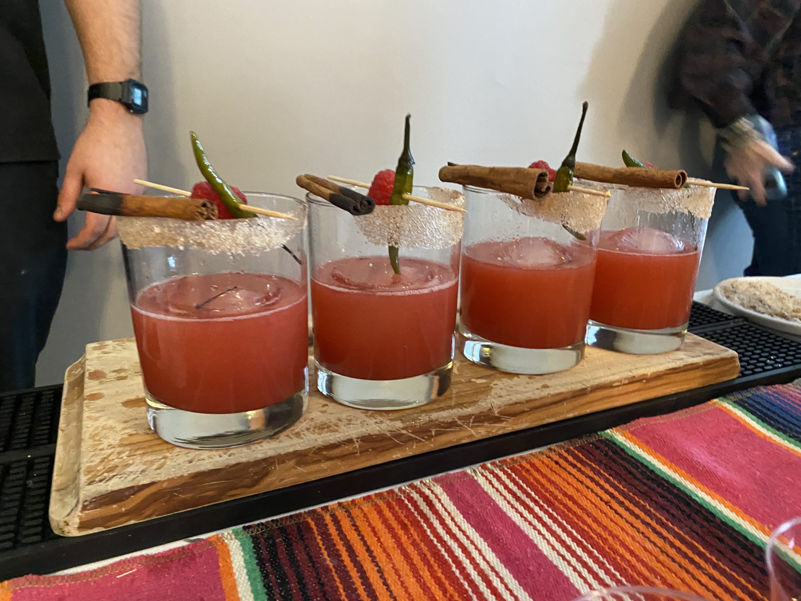 three glasses filled with different types of drinks