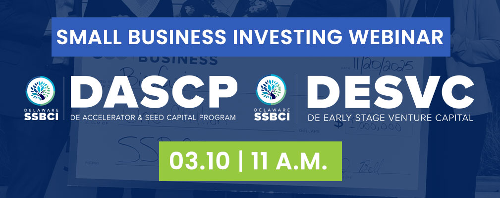 a group of people standing next to a sign