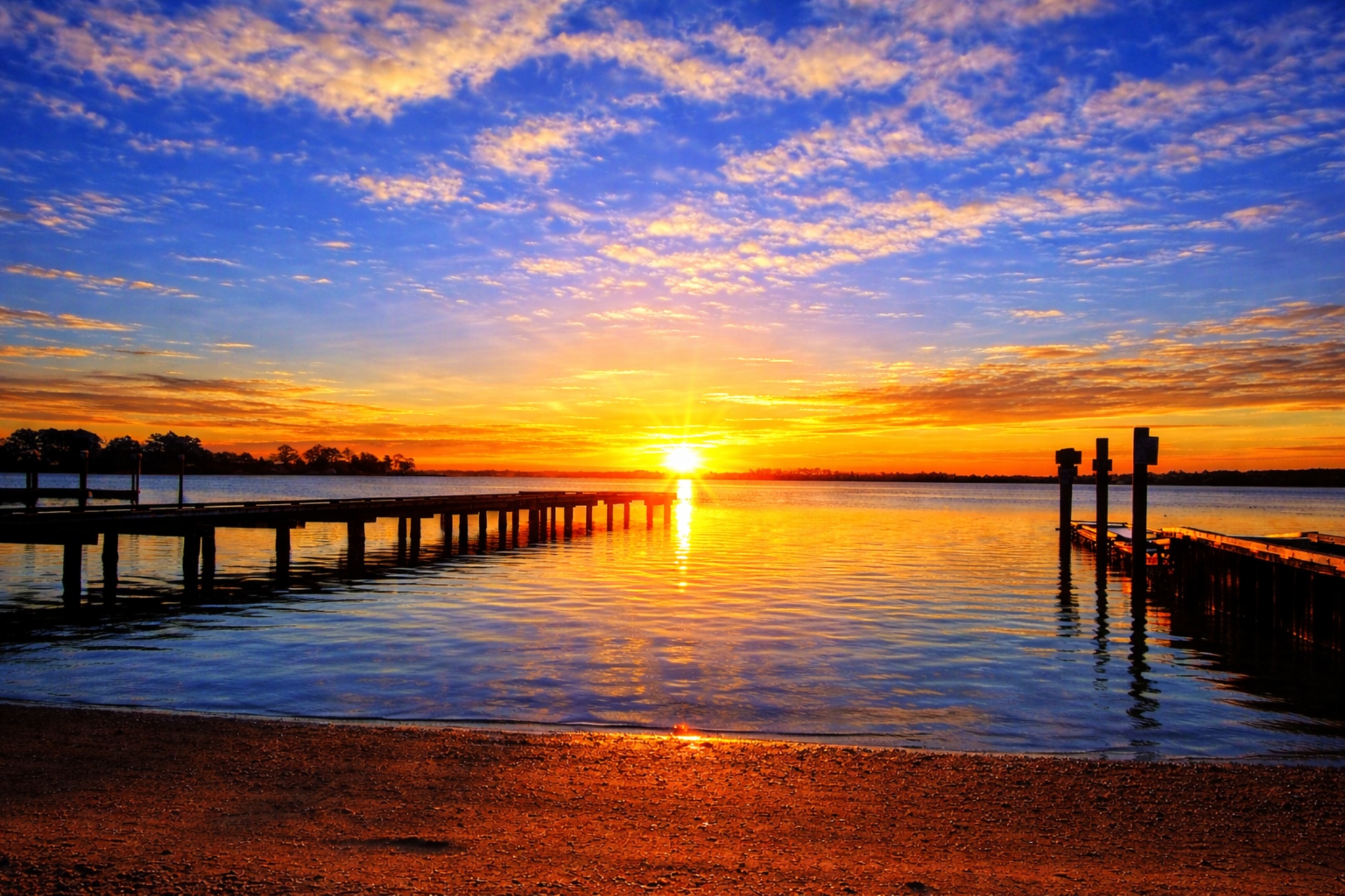 a sunset over a body of water