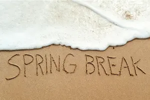 the word spring break written in sand on a beach