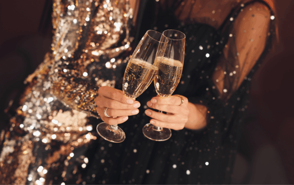 two women holding champagne flutes in their hands