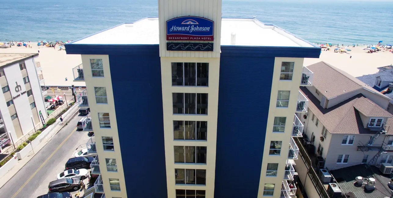 an aerial view of a hotel near the beach