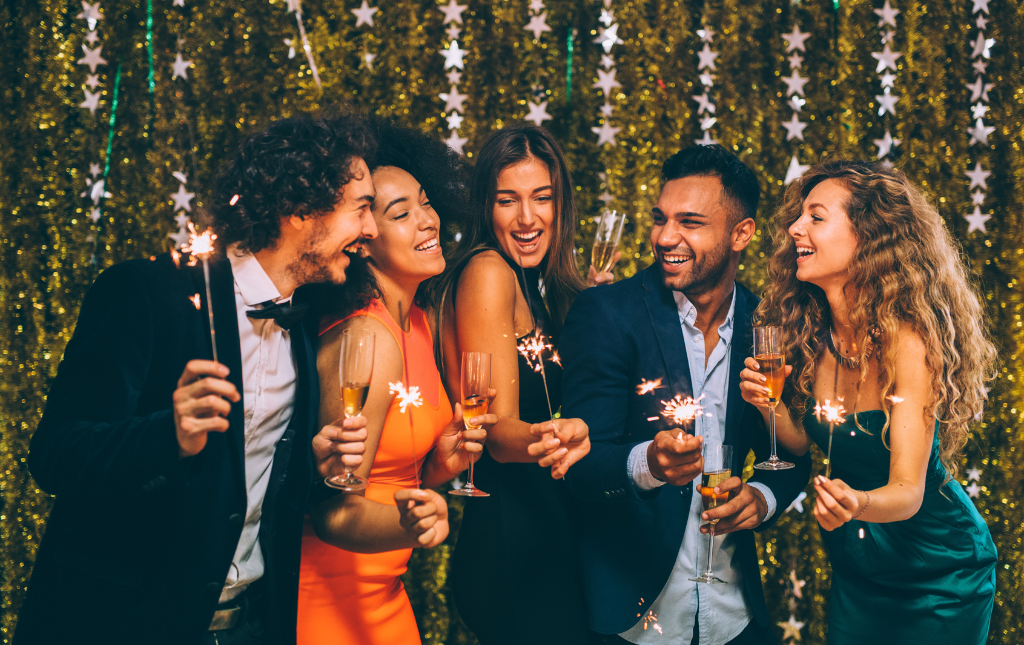 a group of people holding sparklers in their hands