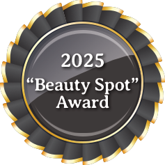 a black and gold badge with the words beauty spot award