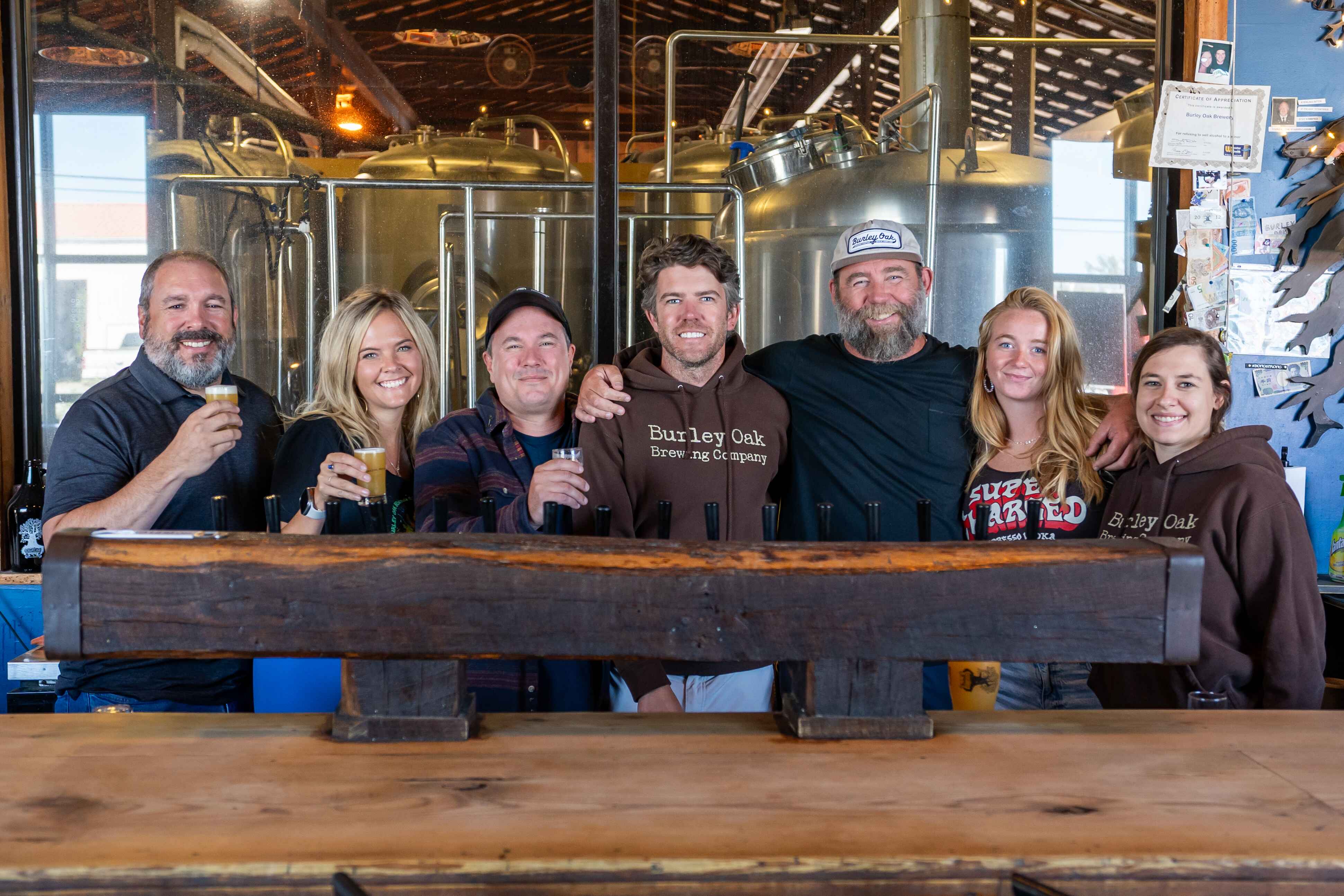 Burley Oak team standing behind the bar