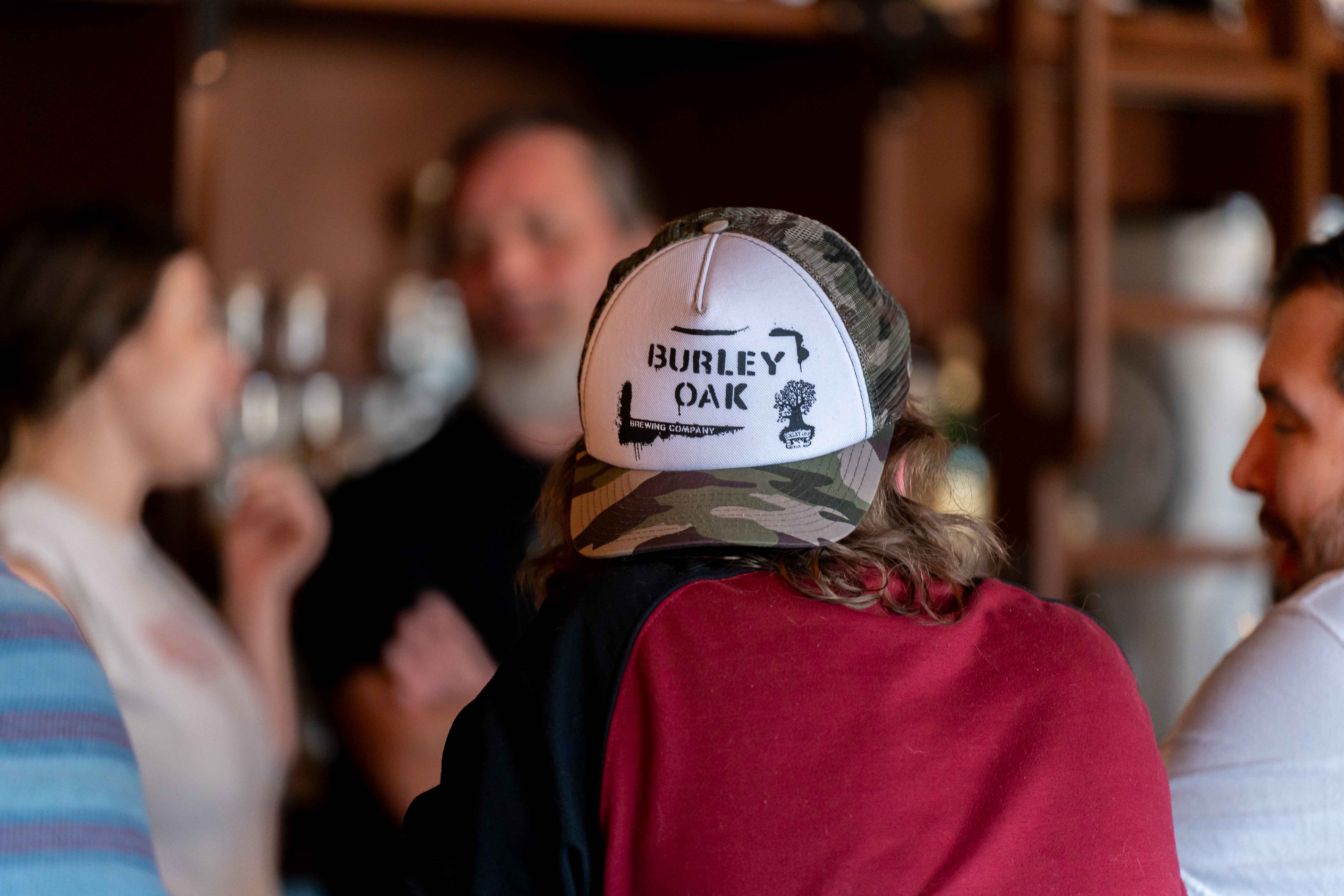 a group of people standing around a bar