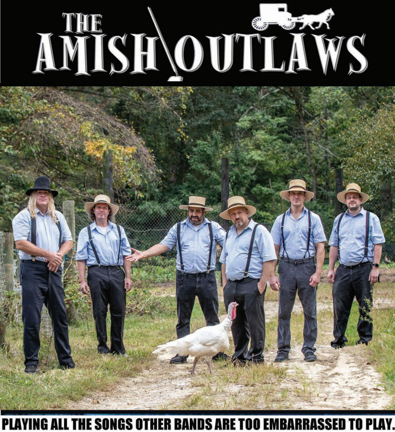 a group of men standing on top of a dirt road
