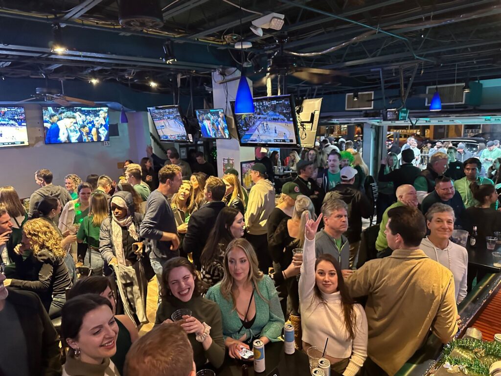 a group of people standing around each other