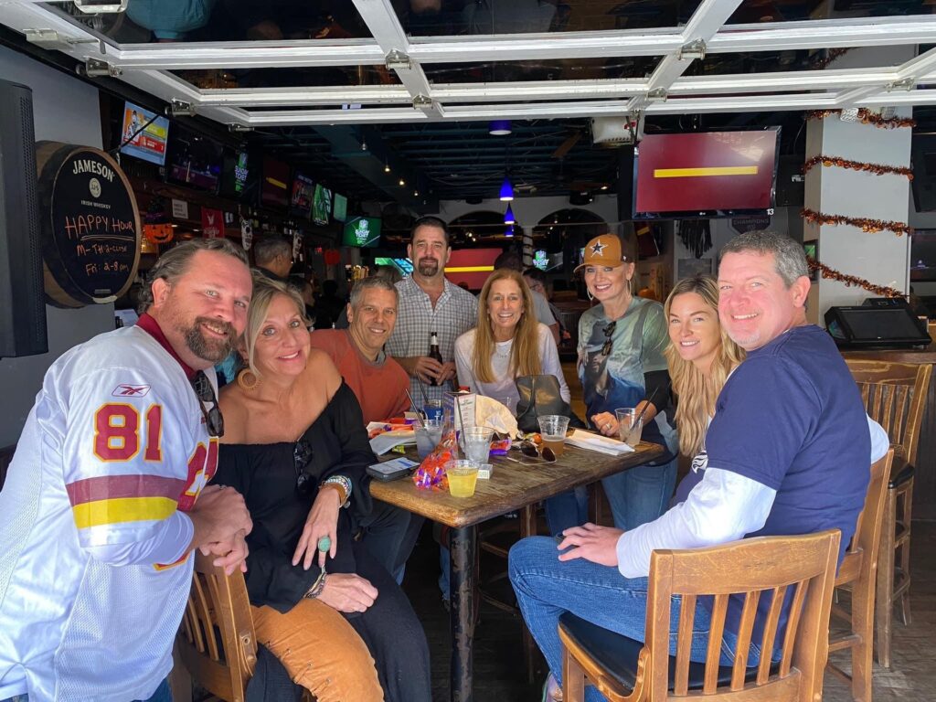 a group of people sitting around a table
