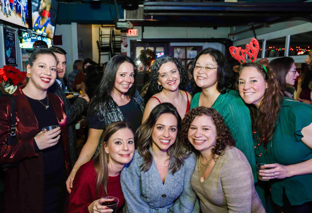 a group of women standing next to each other