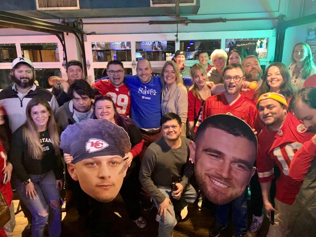 a large group of people posing for a photo