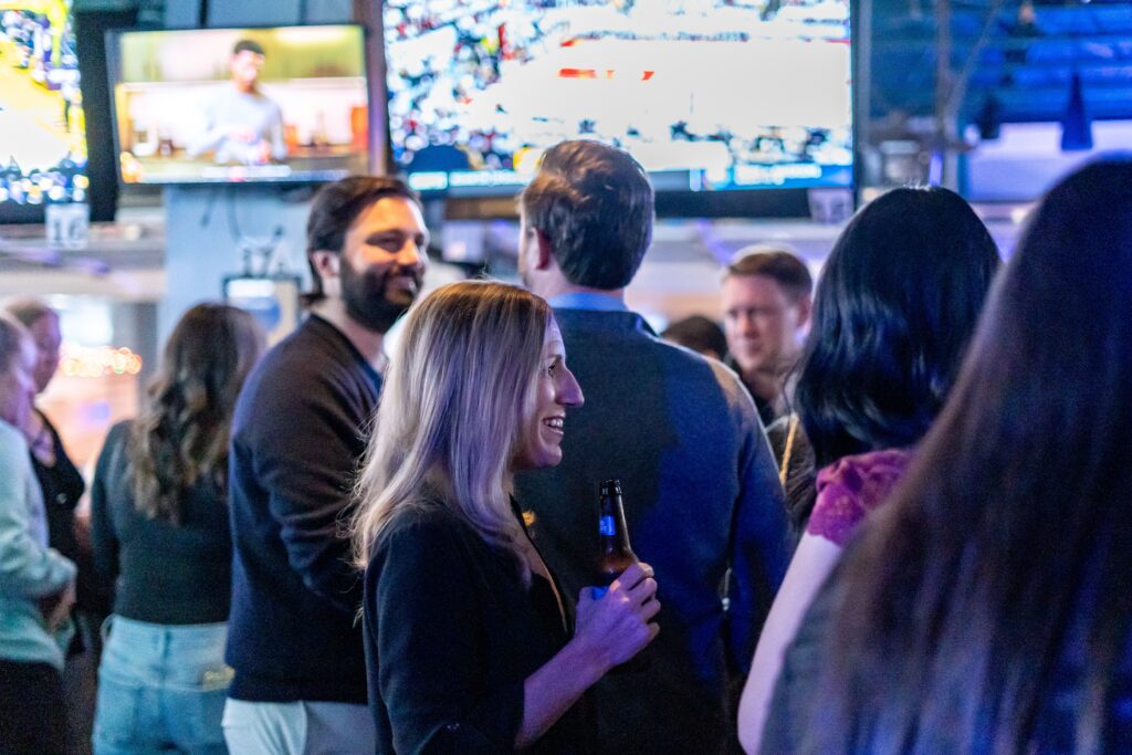 a group of people standing around each other