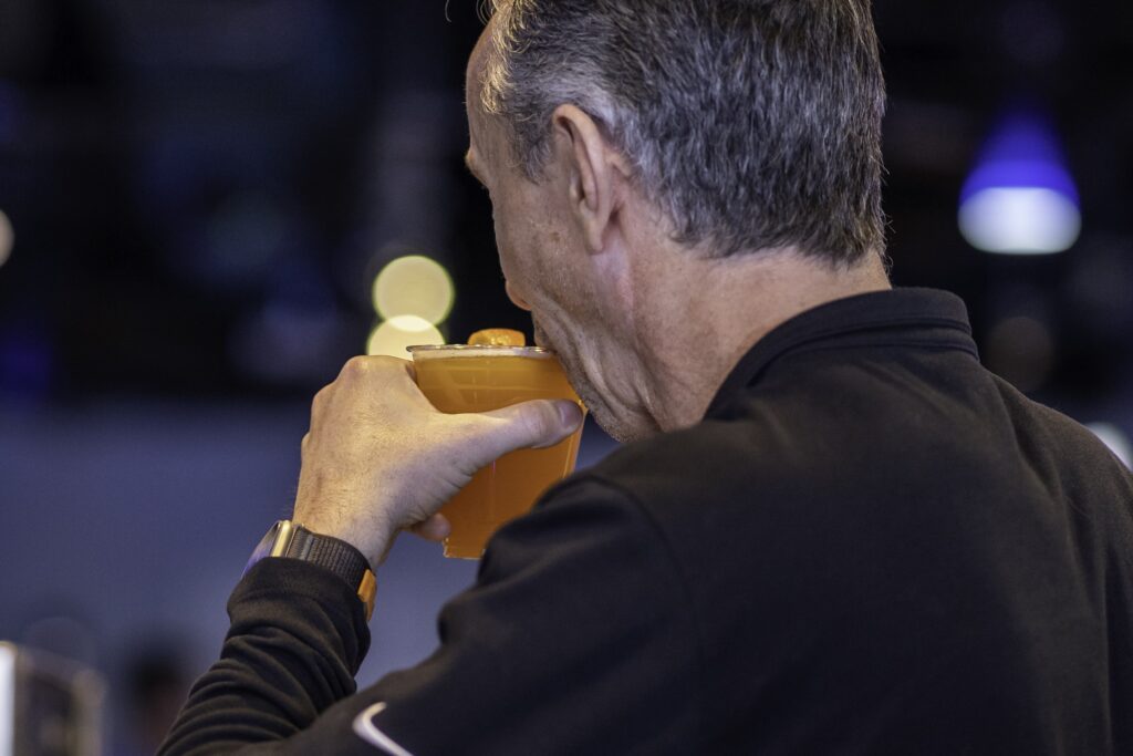 a man eating a sandwich with his hand