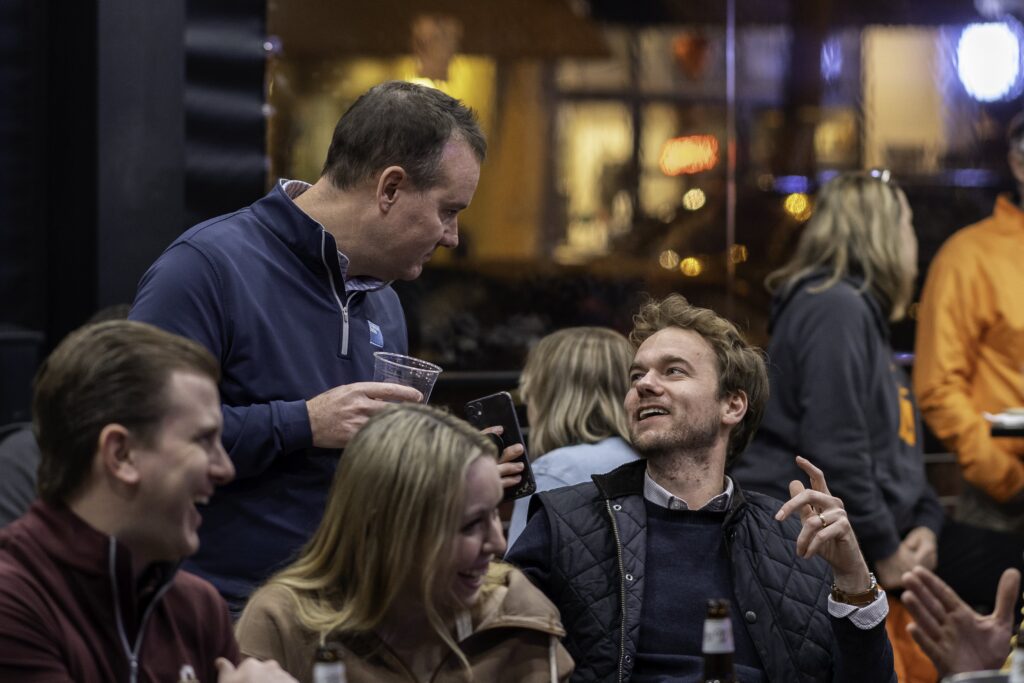 a group of people sitting around each other