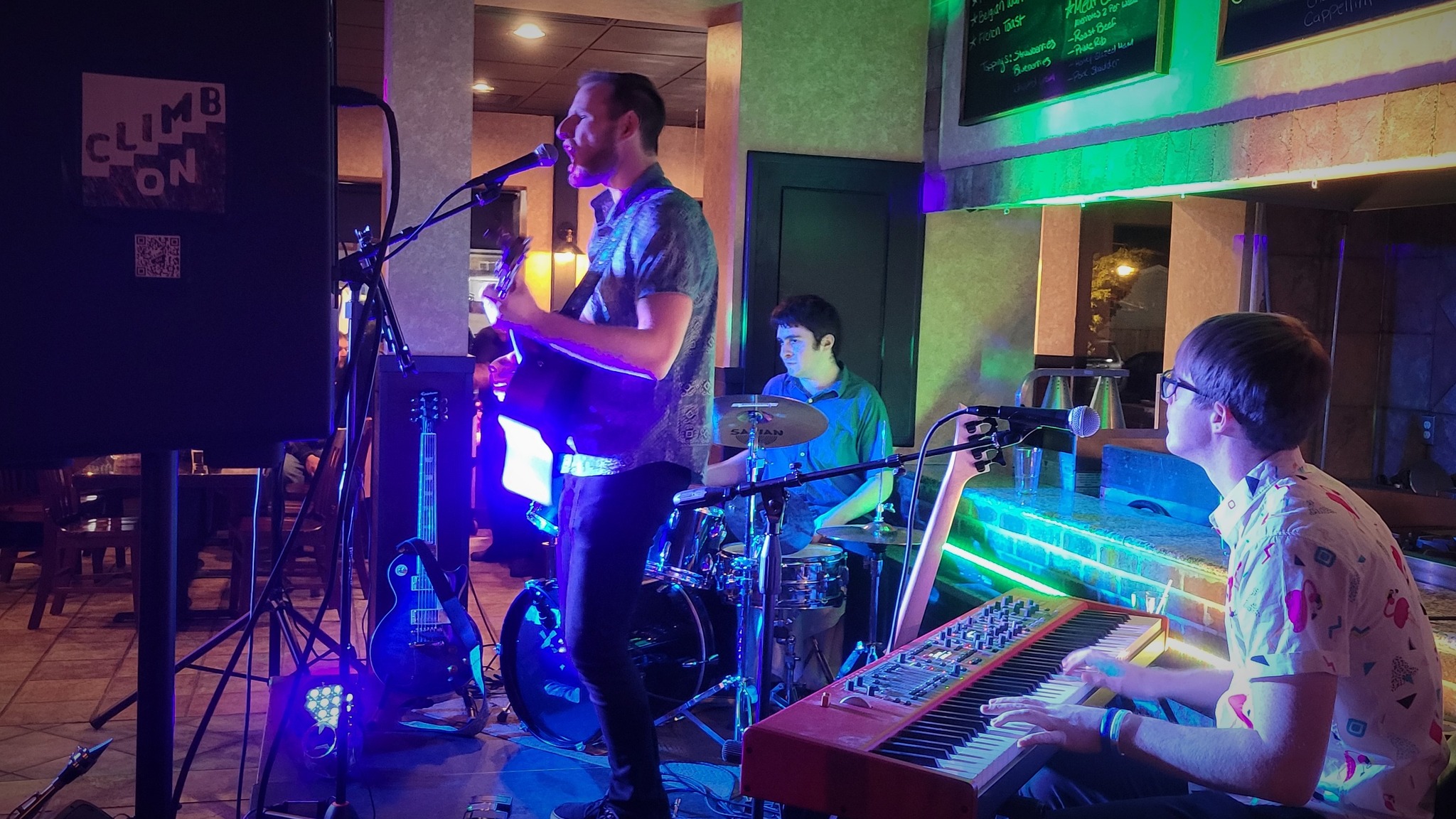 a group of people playing music in a room