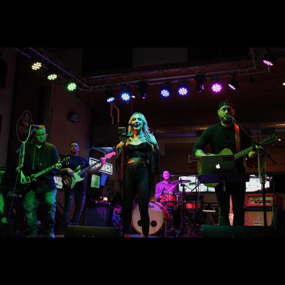 a group of people that are standing on a stage