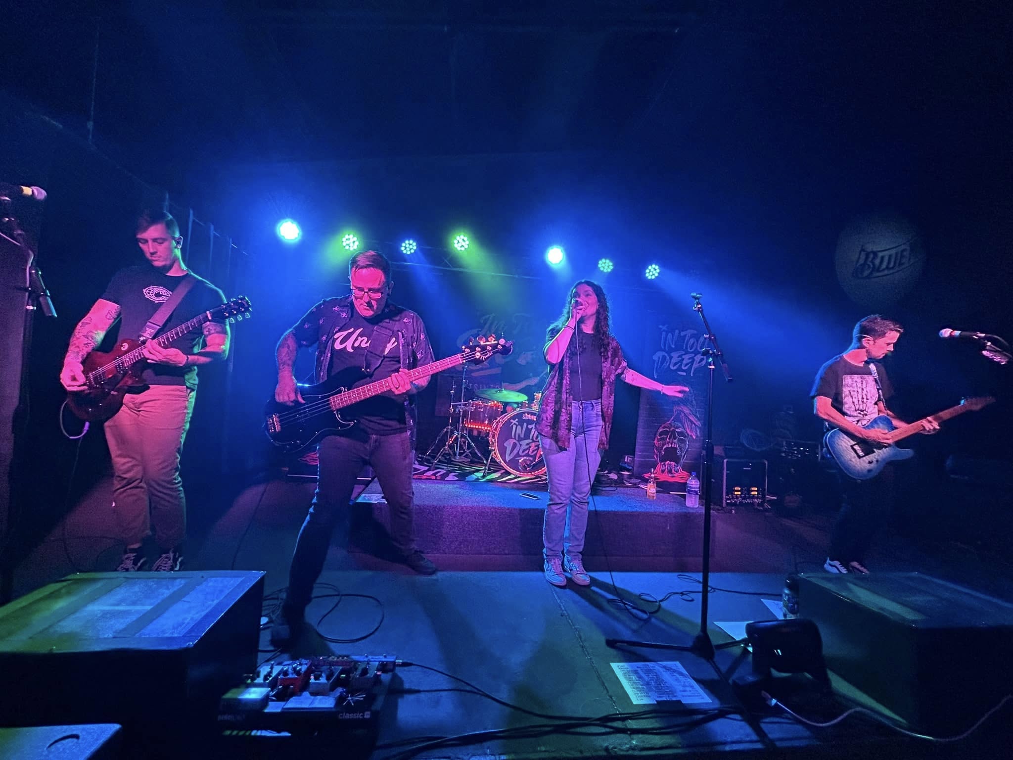a band playing on stage at night