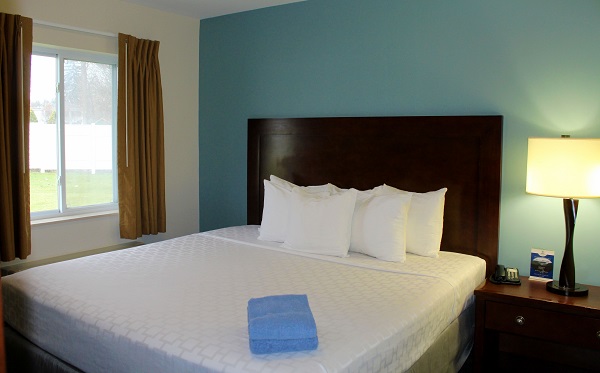 Bed made with white bed sheets