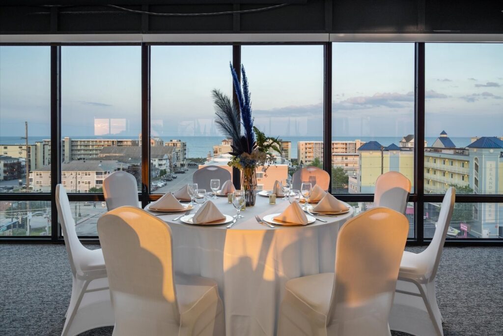 a dining room with a view of the ocean