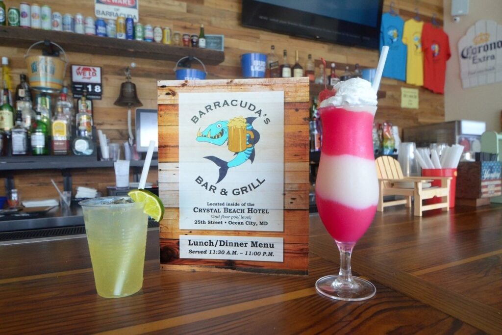 a bar with two drinks and a menu