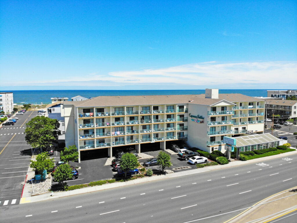 an aerial view of a hotel and parking lot