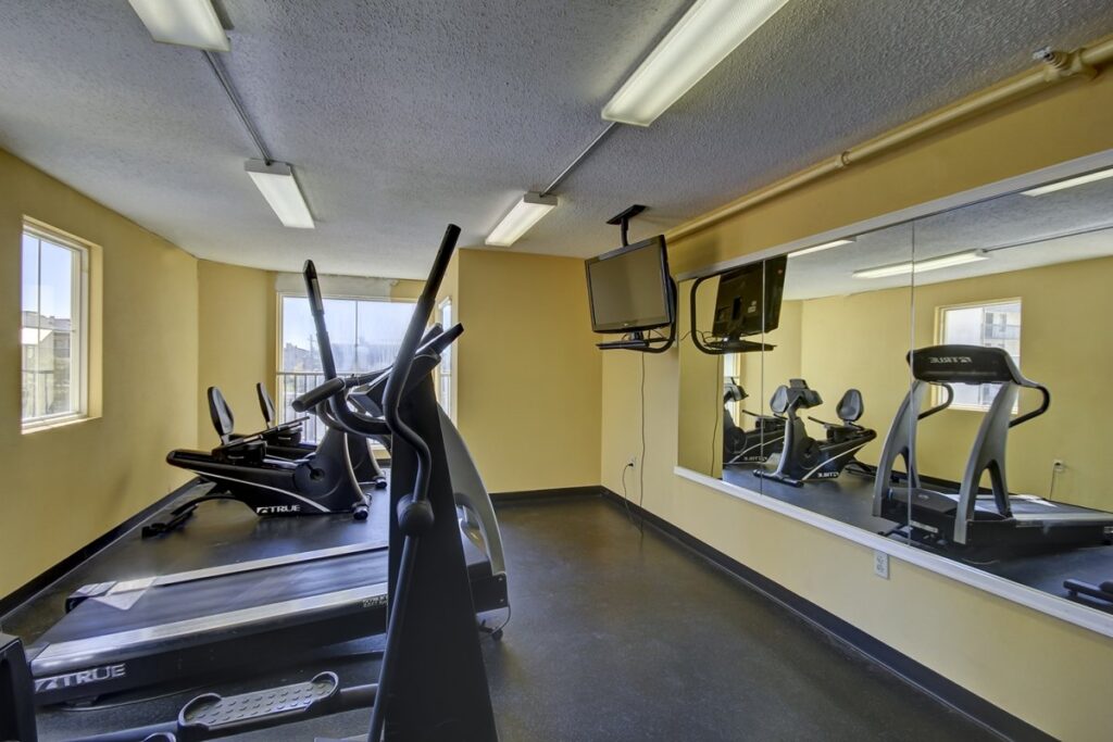 a gym with treadmills and exercise machines