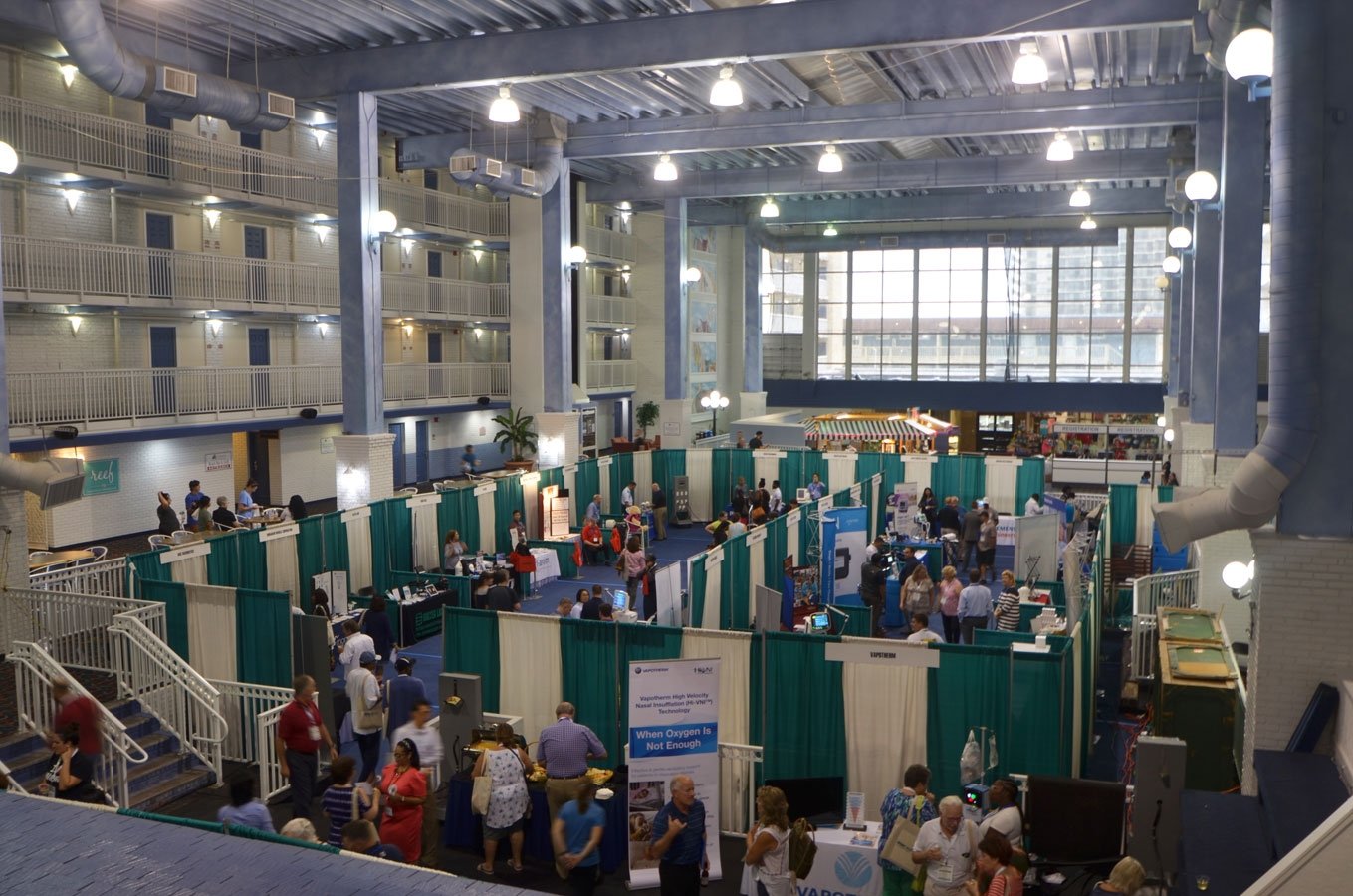 an indoor event with people standing around
