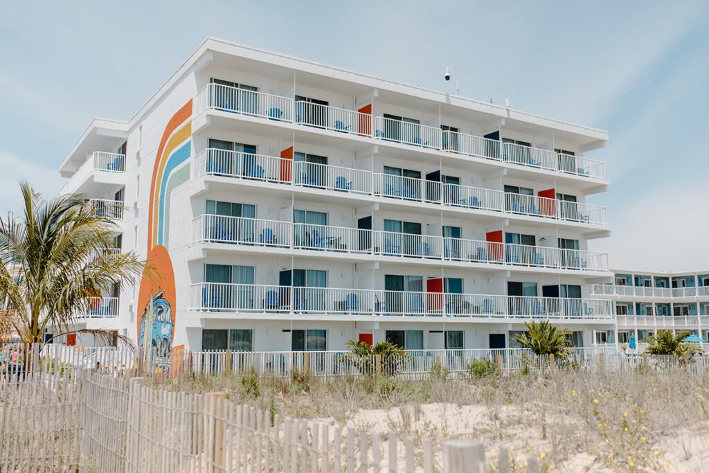 a beach front view of a multi story building