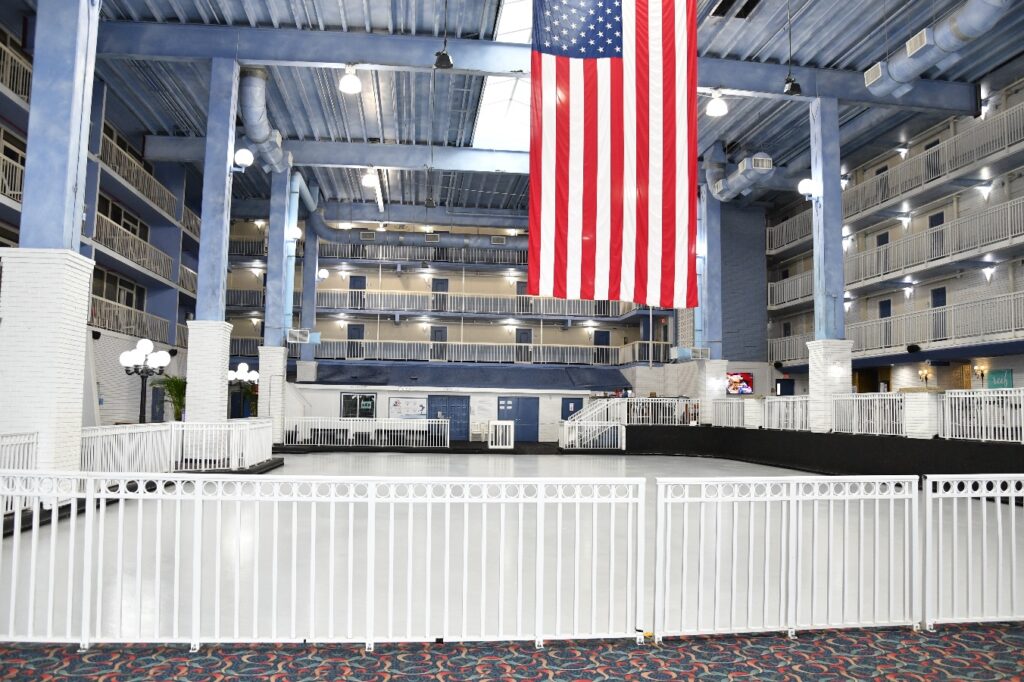 an american flag hanging from the ceiling of a building