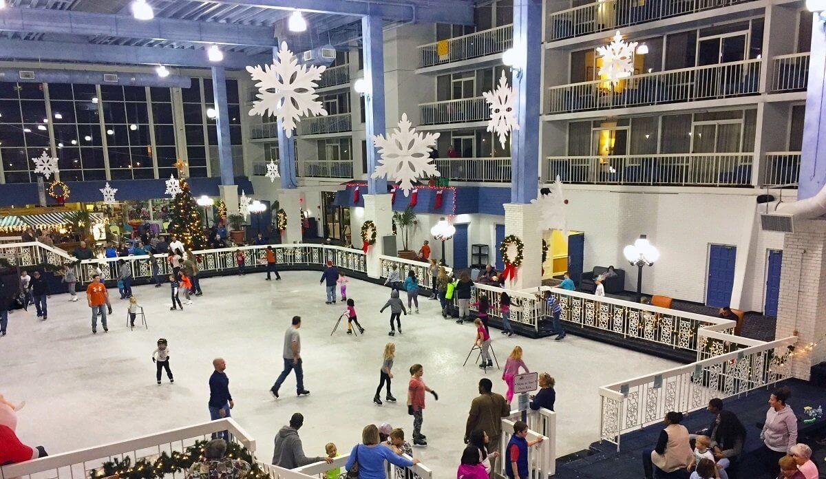 a group of people skating on an ice rink
