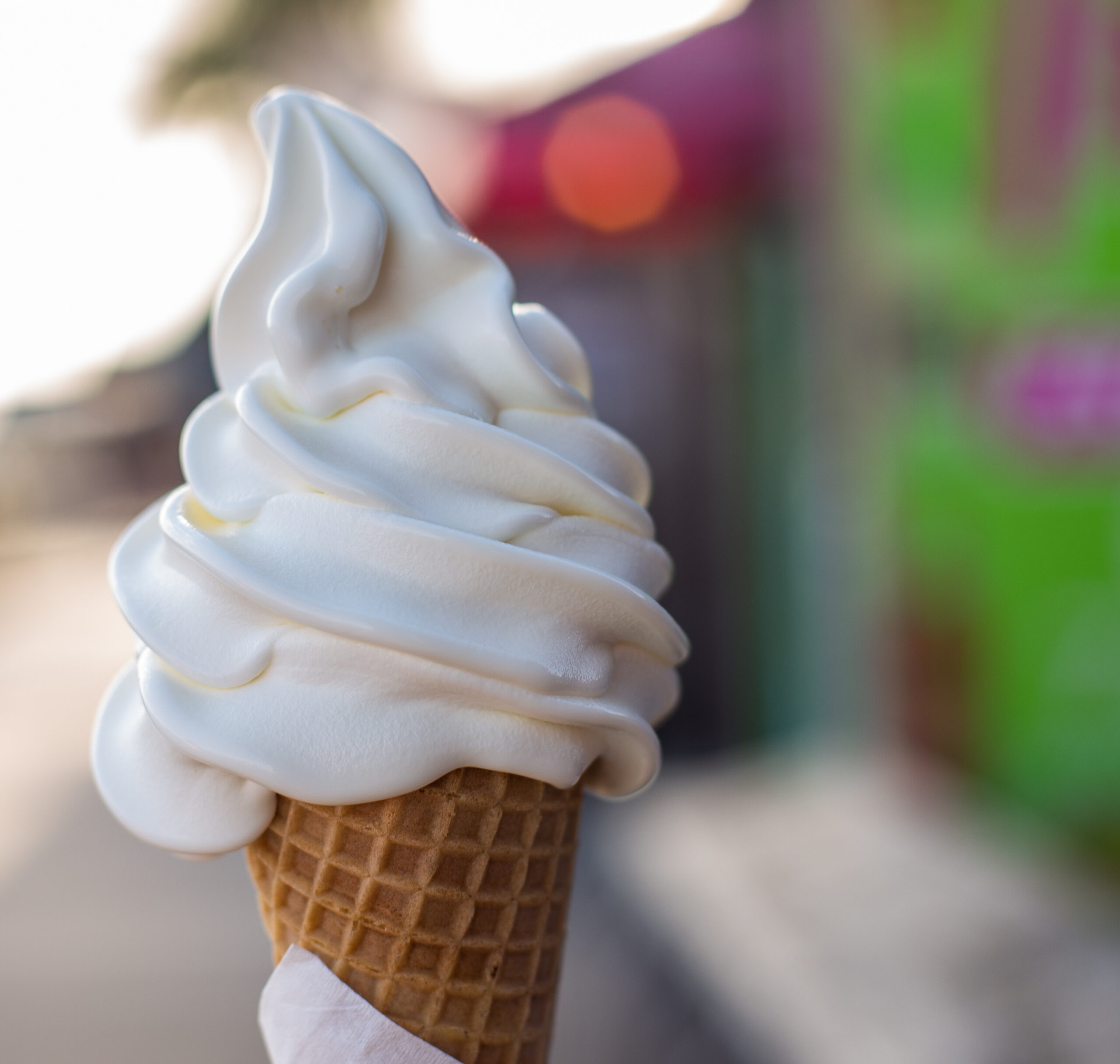 an ice cream cone with whipped cream on top