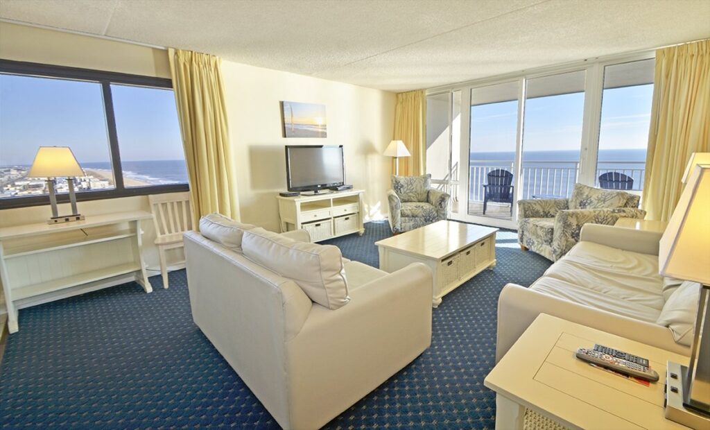 a living room filled with furniture and a flat screen tv