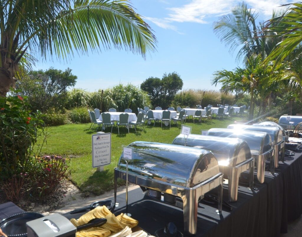 a buffet table with bananas and other foods on it
