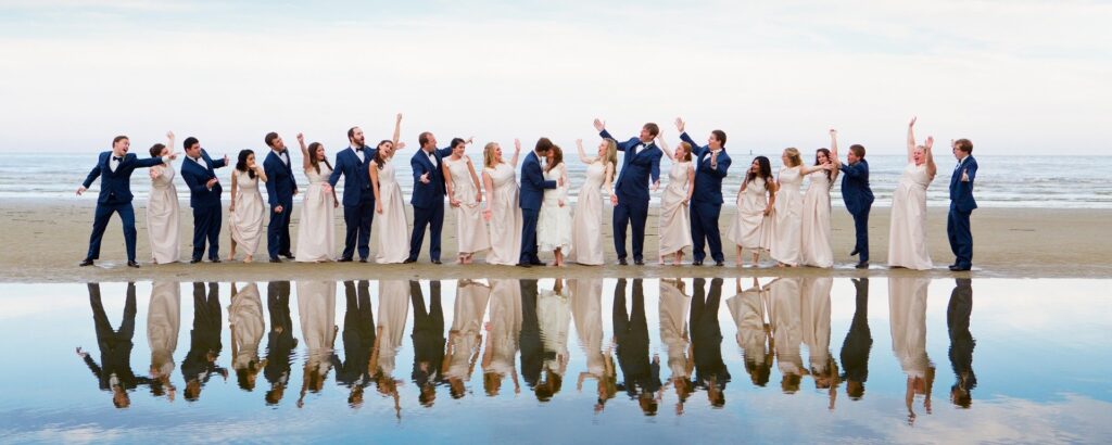 a group of people standing on top of a beach