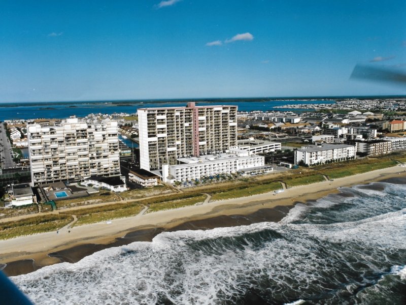 an aerial view of a city and the ocean