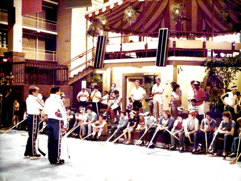 a group of people sitting in front of a building