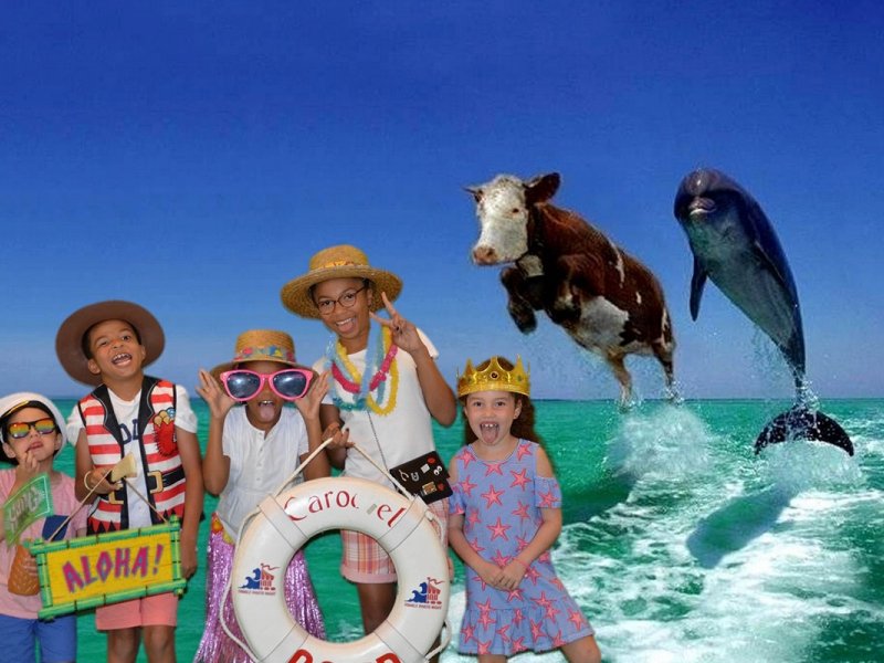 a group of children standing on top of a boat