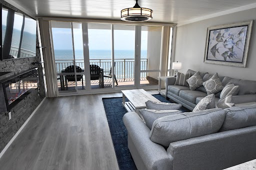 a living room filled with furniture and a fire place
