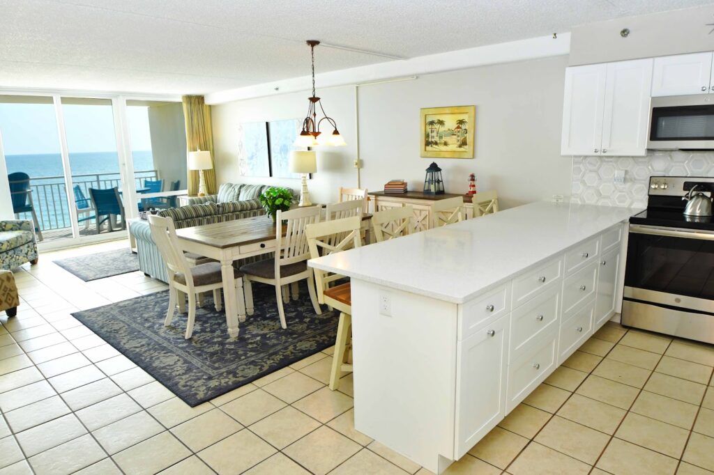 a kitchen and living room with an ocean view