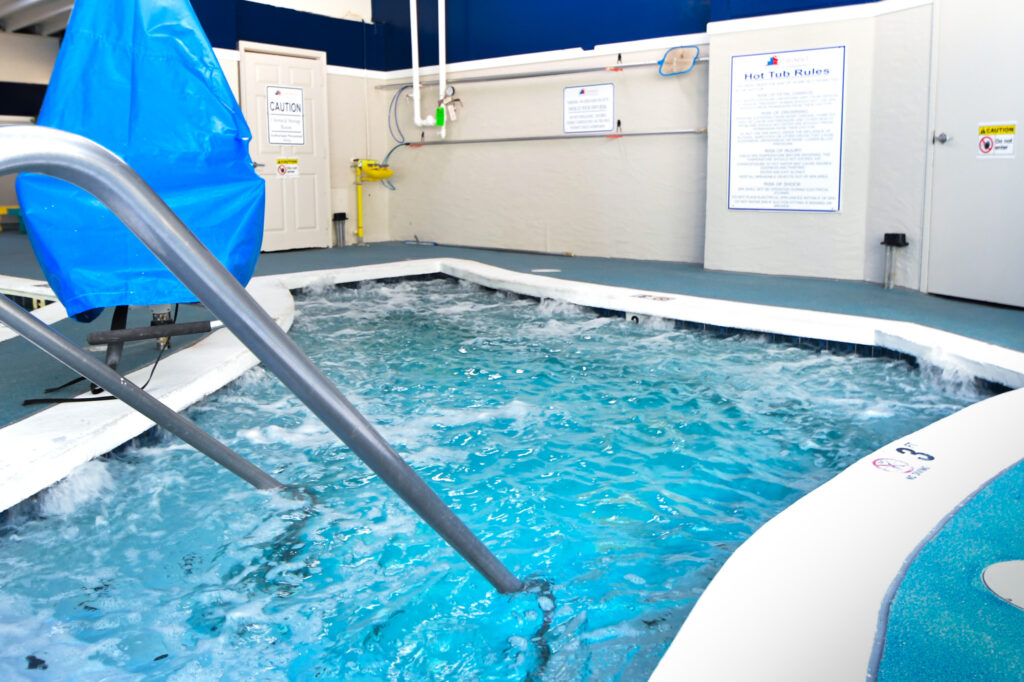 an indoor swimming pool with blue water