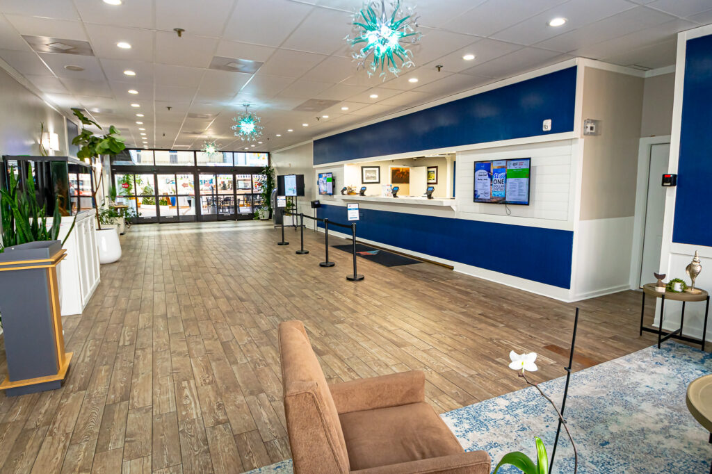 a large room with blue walls and wooden floors
