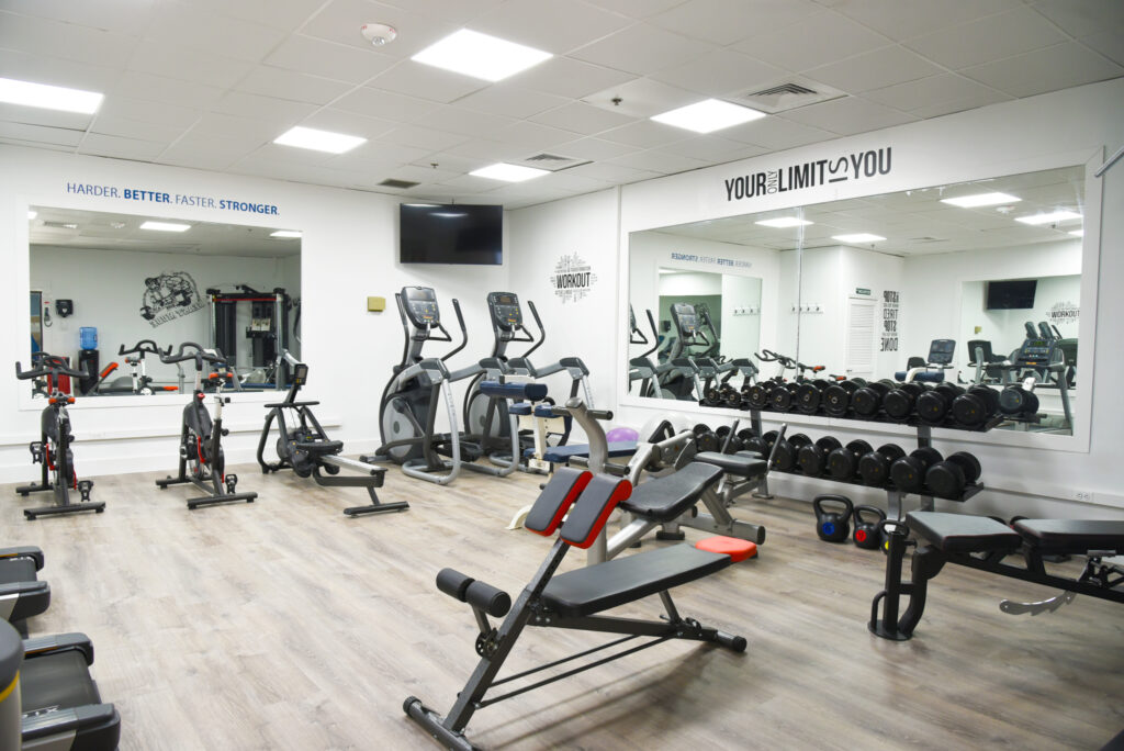a gym with a variety of exercise equipment