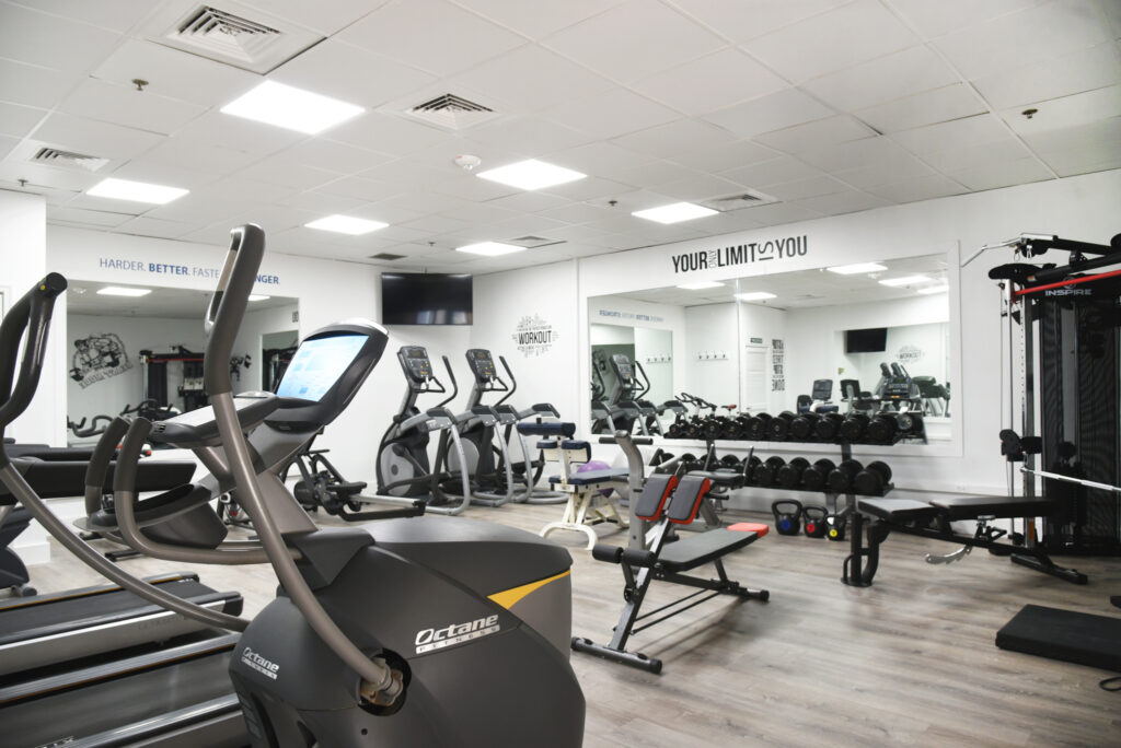 a gym with a variety of exercise equipment