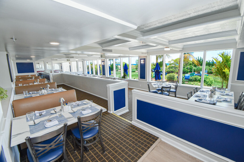 a restaurant with blue and white walls and tables