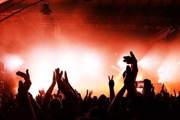 Audience hands in the air at a concert.