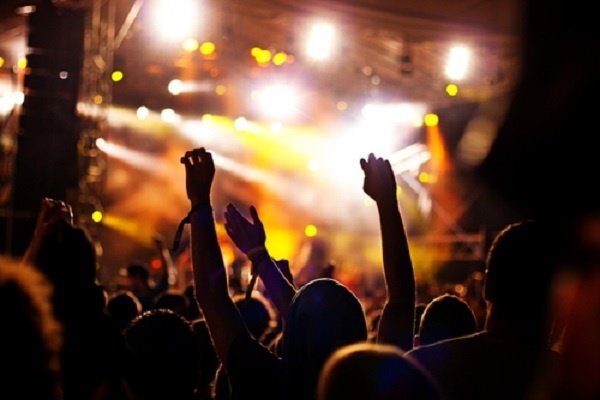 Fans' hands at a concert.