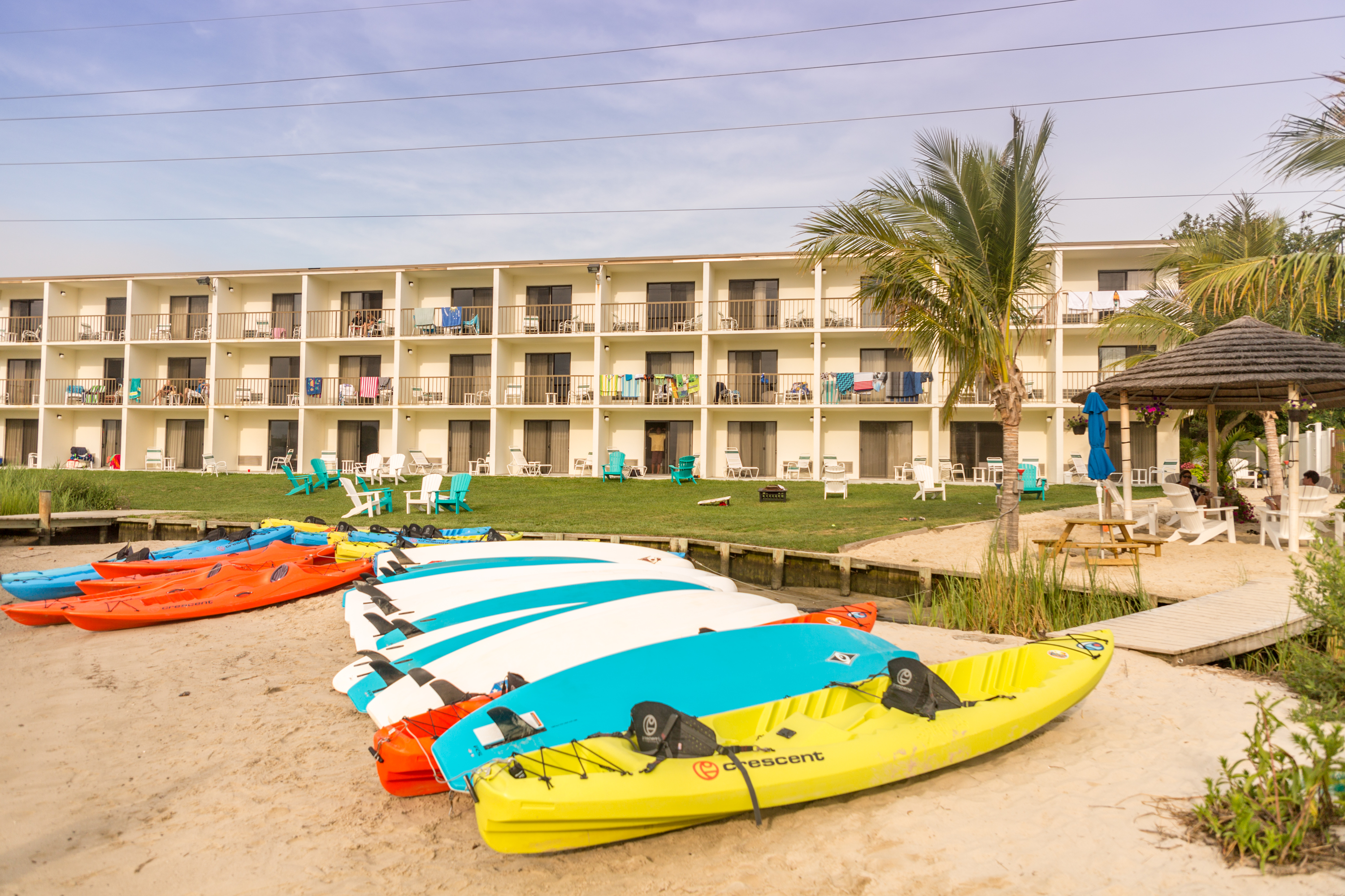 a group of boats sitting on top of a sandy beach