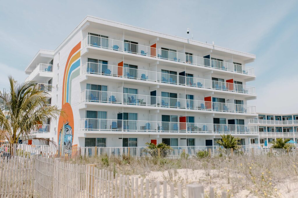a beach front view of a multi story building