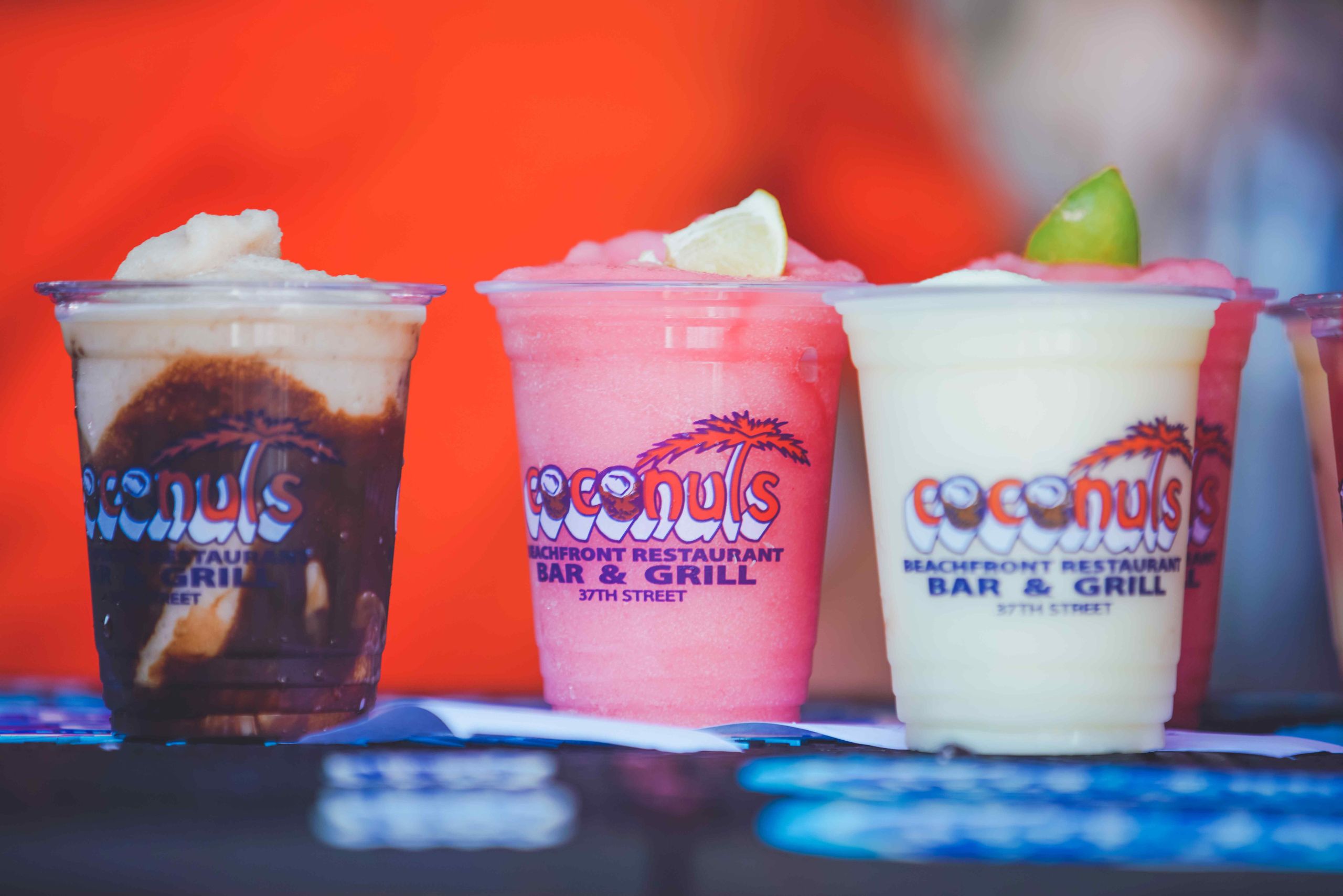 a row of different types of drinks on a table