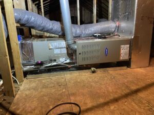 a furnace in a room with a wooden floor